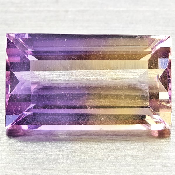 Natural Bi Color Ametrine 3.52 Ct. Baguette Shape 12.1 x 7 Mm Gemstone From Bolivia: Product ID: 800408489 Product Name: Natural Ametrine Weight: 3.52 CT. Size: 12.1 x 7 x 5.3 MM. Shape: Baguette Color: Bi Color Clarity:VSI Luster: Good Gems Origin: Bolivia Treatment: Unheated Crystal