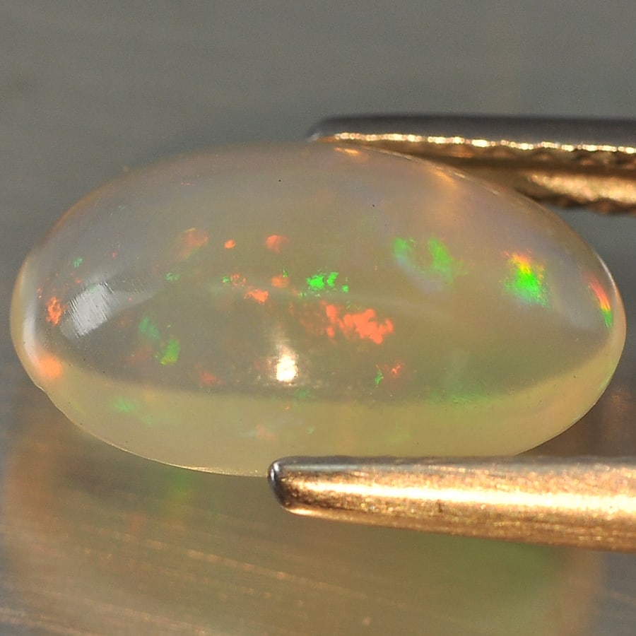 Natural Multi Color Opal 1.57 Ct. Oval Cabochon Shape 11.8 x 7.6 Mm Gemstone from Ethiopia (1 of 3)