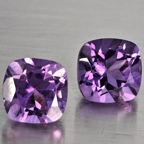 Natural Purple Amethyst 1.19 Ct. 2 Pcs Cushion Shape 6.1 Mm Gemstone From Brazil: Product ID: 800325571 Product Name: Natural Amethyst Weight: 1.19 CT. Size: 6.1 x 6.1 x 4.9 MM. Shape: Cushion Shape Color: Purple Clarity:SI1 Luster: Good Gems Origin: Brazil Treatment: Unheated Crys