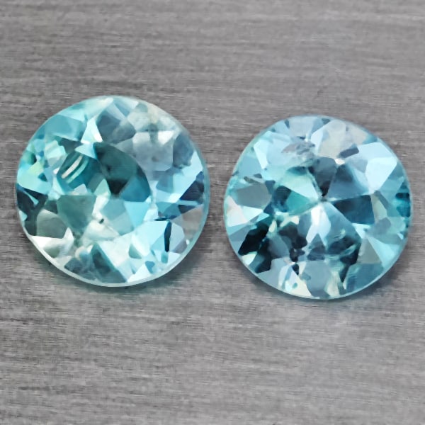 Natural Baby Blue Zircon 1.17 Ct. 2 Pcs Round Diamond Cut 4.8 Mm Gemstone from Cambodia: Product ID: 807743218 Product Name: Natural Zircon Weight: 1.17 CT. Size: 4.8 x 4.8 x 3 MM. Shape: Round Diamond Cut Color: Baby Blue Clarity:SI1 Luster: Good Gems Origin: Cambodia Treatment: Heated C