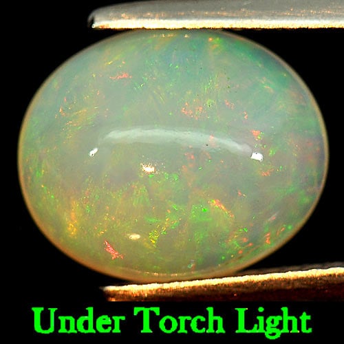 Natural Multi-Color Opal 3.02 Ct. Oval Cabochon Shape 12.3 x 10.3 Mm. Gemstone from Ethiopia (1 of 3)