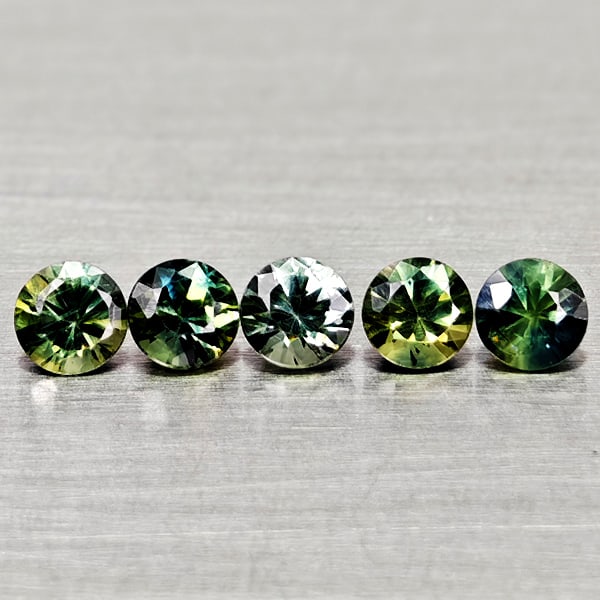 Natural Fancy Color Sapphire 0.88 Ct. 5 Pcs Round Diamand Cut 3.4 Mm Gemstones From Tanzania: Product ID: 806162164 Product Name: Natural Green Sapphire Weight: 0.88 CT. Size: 3.4 x 3.4 x 2.2 MM. Shape: Round Diamond Cut Color: Fancy Color Clarity:VSI Luster: Very Good Gems Origin: Tanzania Tr