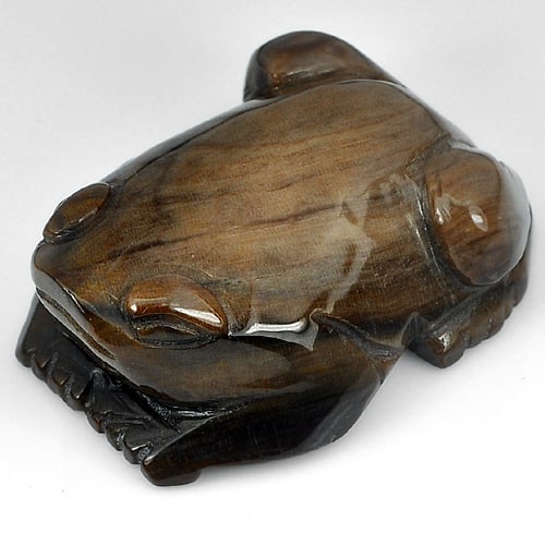 Natural Brown Petrified Wood 277.90 Ct. Frog Carving Shape 48 x 37 Mm Gemstone from Thailand: Product ID: 819102079 Product Name: Natural Petrified Wood Weight: 277.90 CT. Size: 48 x 37 x 19 MM. Shape: Frog Color: Multi-Color Clarity:Opaque Luster: Good Gems Origin: Thailand Treatment: Unheate