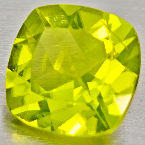 Natural Green Peridot 1.37 Ct. Cushion Shape 7 Mm Gemstone From Pakistan: Product ID: 805317263 Product Name: Natural Peridot Weight: 1.37 CT. Size: 7 x 7 x 4 MM. Shape: Cushion Shape Color: Green Clarity:VSI - SI1 Luster: Good Gems Origin: Pakistan Treatment: Unheated Crys