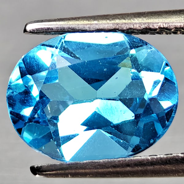 Natural Swiss Blue Topaz 2.23 Ct. Oval Shape 9.3 x 7.3 Mm Gemstone From Brazil: Product ID: 807168143 Product Name: Natural Blue Topaz Weight: 2.23 CT. Size: 9.3 x 7.3 x 4.5 MM. Shape: Oval Shape Color: Swiss Blue Clarity:VVS - VSI Luster: Good Gems Origin: Brazil Treatment: Trea