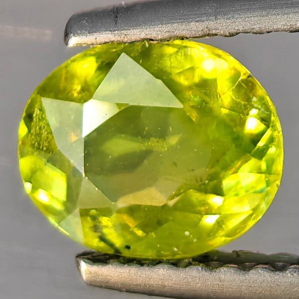 Natural Multi-Color With Rainbow Spark Sphene 1.03 Ct. Oval Shape 7.4 x 6.1 Mm Gemstone From (1 of 3)