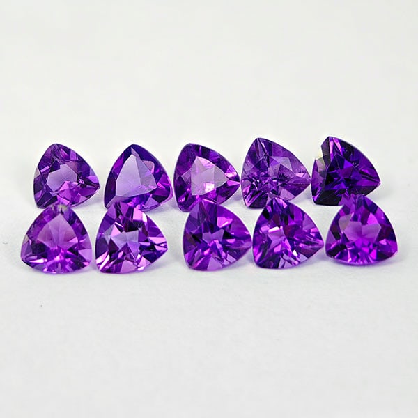 Natural Purple Amethyst 4.05 Ct. 10 Pcs. Trilliant VVS 5.1 x 5.1 Mm. Gemstones from Brazil: Product ID: 800325258 Product Name: Natural Amethyst Weight: 4.05 CT. Size: 5 x 5 x 3.5 MM. Shape: Trilliant Color: Purple Clarity:VVS Luster: Good Gems Origin: Brazil Treatment: Unheated Crystal Stru