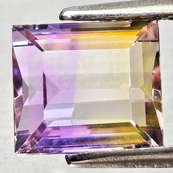 Natural Bi Color Ametrine 1.87 Ct. Octagon Shape 7.6 x 6.8 Mm Gemstone From Bolivia: Product ID: 800408342 Product Name: Natural Ametrine Weight: 1.87 CT. Size: 7.6 x 6.8 x 4.5 MM. Shape: Octagon Color: Bi Color Clarity:VSI Luster: Good Gems Origin: Bolivia Treatment: Unheated Crystal