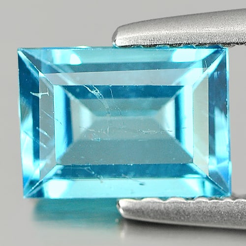 Natural Swiss Blue Topaz 1.13 Ct. Baguette Shape 7 x 5.1 Mm Gemstone from Brazil: Product ID: 807132493 Product Name: Natural Blue Topaz Weight: 1.13 CT. Size: 7 x 5.1 x 3.3 MM. Shape: Baguette Color: Swiss Blue Clarity:VVS Luster: Good Gems Origin: Brazil Treatment: Treated Crysta