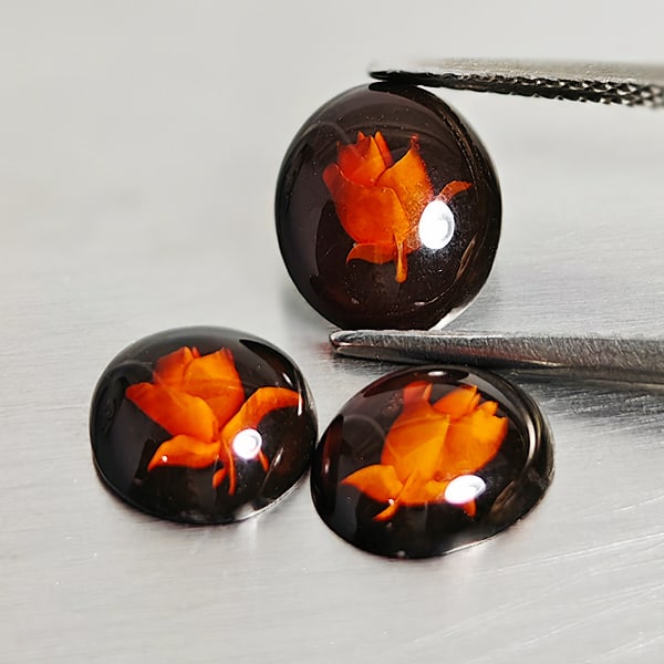 Natural Brown Yellow Amber 1.79 Ct. 3 Pcs. Flower Carving In Oval Cabochon Shape 9.8 x 8.2 Mm: Product ID: 819091002 Product Name: Natural Amber Weight: 1.79 CT. Size: 9.8 x 8.2 x 2.7 MM. Shape: Oval Cabochon Color: Brown Yellow Clarity:Semi - Transparent Luster: Good Gems Origin: Poland Treatm