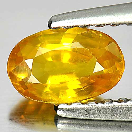 Natural Yellow Sapphire 0.65 Ct. Oval Shape 6.5 x 4.2 Mm. Gemstone From Thailand: Product ID: 806158713 Product Name: Natural Yellow Sapphire Weight: 0.65 CT. Size: 6.5 x 4.2 x 2.7 MM. Shape: Oval Color: Yellow Clarity:VSI Luster: Good Gems Origin: Thailand Treatment: Heated Crysta