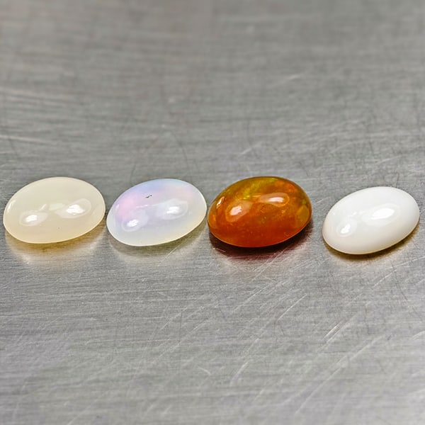 Natural Multi-Color Play Of Colour Opal 3.08 Ct. 4 Pcs Oval Cabochon Shape 8.3 x 6.3 Mm Gemstone: Product ID: 818728039 Product Name: Natural Opal Weight: 3.08 CT. Size: 8.3 x 6.3 x 4.1 MM. Shape: Oval Cabochon Color: Multi-Color Clarity:Semi - Transparent Luster: Good Gems Origin: Ethiopia Treatm