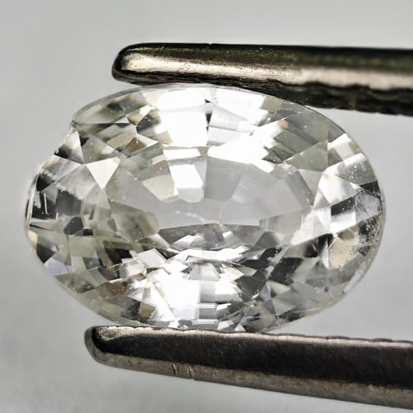 Natural White Zircon 1.12 Ct. Oval Shape 7 x 5 Mm. Gemstone From Cambodia: Product ID: 807742851 Product Name: Natural Zircon Weight: 1.12 CT. Size: 7 x 5 x 3.4 MM. Shape: Oval Color: White Clarity:VSI Luster: Good Gems Origin: Cambodia Treatment: Heated Crystal Structure: T