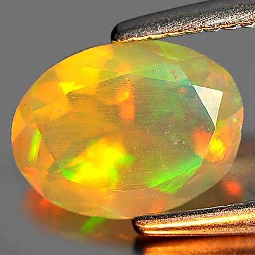 Natural Multi Color Play Of Colour Opal 0.59 Ct. Oval Shape 7.8 x 5.9 Mm. Gemstone from Ethiopia (1 of 3)