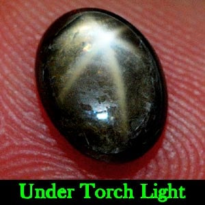 Natural Black Star Sapphire 2.33 Ct. Oval Cabochon Shape 8.3 x 6.1 Mm Gemstone From Thailand: Product ID: 806130335 Product Name: Natural Star Sapphire Weight: 2.33 CT. Size: 8.3 x 6.1 x 4.3 MM. Shape: Oval Cabochon Color: Black Clarity:Opaque Luster: Good 6 Rays Star Gems Origin: Thailand Tre