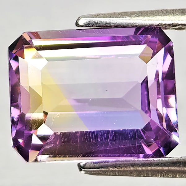 Natural Bi Color Ametrine 2.51 Ct. Octagon Shape 9.2 x 7.2 Mm Gemstone From Bolivia: Product ID: 800408233 Product Name: Natural Ametrine Weight: 2.51 CT. Size: 9.2 x 7.2 x 4.9 MM. Shape: Octagon Color: Bi Color Clarity:VSI Luster: Good Gems Origin: Bolivia Treatment: Unheated Crystal