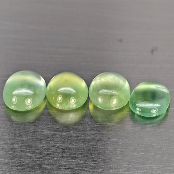 Natural Green Prehnite 6.90 Ct. 4 Pcs Oval Cabochon Shape Gemstones From Australia: Product ID: 818802950 Product Name: Natural Prehnite Weight: 6.90 CT. Size: 8.5 x 7 x 4.6 to 8 x 7.3 x 4.7 MM. Shape: Oval Cabochon Color: Green Clarity:Semi - Transparent Luster: Good Gems Origin: Au