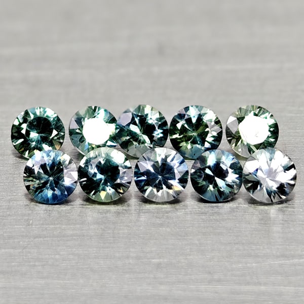 Natural Fancy Color Sapphire 0.85 Ct. 10 Pcs. Round Diamand Cut 2.6-2.7 Mm. Gemstone From Tanzania: Product ID: 806162192 Product Name: Natural Green Sapphire Weight: 0.85 CT. Size: 2.7 x 2.7 x 1.7 to 2.6 x 2.6 x 1.7 MM. Shape: Round Diamond Cut Color: Fancy Color Clarity:VVS-VSI Luster: Very Good G