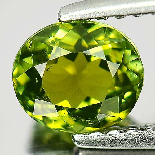 Natural Green Tourmaline 0.83 Ct. Oval Shape 6.2 x 5.3 Mm Gemstone from Nigeria: Product ID: 807246744 Product Name: Natural Tourmaline Weight: 0.83 CT. Size: 6.2 x 5.3 x 3.7 MM. Shape: Oval Color: Green Clarity:VSI Luster: Good Gems Origin: Nigeria Treatment: Unheated Crystal Str
