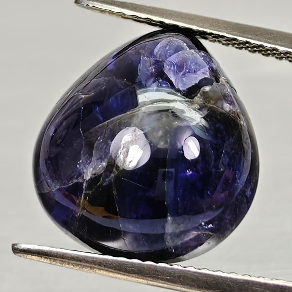 Natural Deep Blue Purple Diffusion Sapphire 10.20 Ct. Pear Cabochon Shape 14.6 x 14 Mm Gemstone from: Product ID: 806012027 Product Name: Natural Weight: 10.20 CT. Size: 14.6 x 14 x 7.6 MM. Shape: Pear Cabochon Color: Blue Purple Clarity:Opaque Luster: Good Gems Origin: Madagascar Treatment: Diffusion