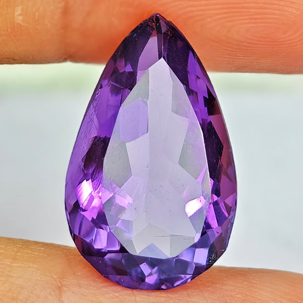 Natural Purple Amethyst 7.28 Ct. Pear Shape 17 x 10.6 Mm Gemstone From Brazil: Product ID: 800325421 Product Name: Natural Amethyst Weight: 7.28 CT. Size: 17 x 10.6 x 7.4 MM. Shape: Pear Shape Color: Purple Clarity:VSI Luster: Good Gems Origin: Brazil Treatment: Unheated Crystal
