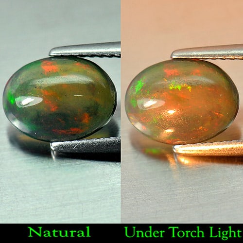 Natural Fire Red Black Opal 1.51 Ct. Oval Cabochon Shape 10.6 x 8 Mm. Gemstone: Product ID: 818724611 Product Name: Natural Opal Weight: 1.51 CT. Size: 10.6 x 8 x 4 MM. Shape: Oval Cabochon Color: Rainbow Fire Red Black Clarity:Semi - Transparent Luster: Iridescent Gems Origin: E