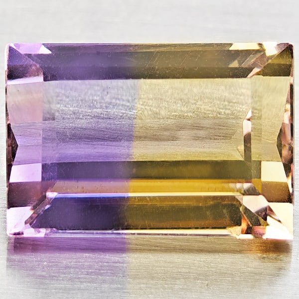 Natural Bi Color Ametrine 2.78 Ct. Baguette Shape 10 x 6.8 Mm Gemstone From Bolivia: Product ID: 800408474 Product Name: Natural Ametrine Weight: 2.78 CT. Size: 10 x 6.8 x 5.1 MM. Shape: Baguette Color: Bi Color Clarity:VSI Luster: Good Gems Origin: Bolivia Treatment: Unheated Crystal