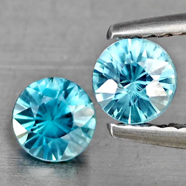 Natural Blue Zircon 1.06 Ct. 2 Pcs Round Diamond Cut 4.5 Mm Gemstone from Cambodia: Product ID: 807743265 Product Name: Natural Gemstones Weight: 1.06 CT. Size: 4.5 x 4.5 x 3.3 MM. Shape: Round Diamond Cut Color: Blue Clarity:SI1 Luster: Good Gems Origin: Cambodia Treatment: Heated C