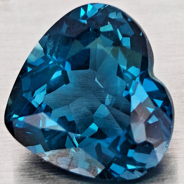 Natural London Blue Topaz 4.63 Ct. VVS Heart Shape 10.6 x 10 Mm. Gemstone From Brazil: Product ID: 807168358 Product Name: Natural Blue Topaz Weight: 4.63 CT. Size: 10.6 x 10 x 6.1 MM. Shape: Heart Shape Color: London Blue Clarity:VVS Luster: Good Gems Origin: Brazil Treatment: Treated
