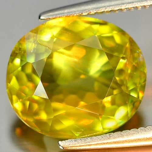Natural Intense Green Titanium Red Spark Sphene 4.03 Ct. Oval Shape 10.8 x 9.3 Mm. Gemstone from: Product ID: 806502936 Product Name: Natural Sphene Weight: 4.03 CT. Size: 10.8 x 9.3 x 5 MM. Shape: Oval Color: Intense Green With Red Spark Clarity:SI Luster: Adamantine Gems Origin: Mardagascar Trea