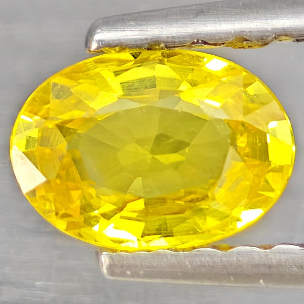 Natural Yellow Sapphire 0.63 Ct. Oval Shape 5.8 x 4.3 Mm Gemstone from Thailand: Product ID: 806162856 Product Name: Natural White Gold Weight: 0.63 CT. Size: 5.8 x 4.3 x 2.4 MM. Shape: Oval Shape Color: Yellow Clarity:VSI Luster: Good Gems Origin: Thailand Treatment: Heated Cryst
