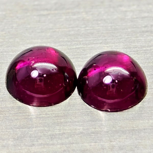 Natural Purplish Pink Rhodolite Garnet 1.33 Ct. 2 Pcs Round Cabochon Shape 5.1Mm Gemstone from: Product ID: 802936750 Product Name: Natural Rhodolite Weight: 1.33 CT. Size: 5.1 x 5.1 x 2.5 MM. Shape: Round Cabochon Color: Purplish Pink Clarity:Semi - Transparent Luster: Good Gems Origin: Madagas