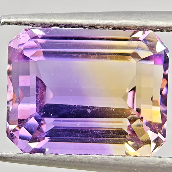 Natural Bi Color Ametrine 6.15 Ct. Octagon Shape 11.5 x 9 Mm Gemstone From Bolivia: Product ID: 800408595 Product Name: Natural Ametrine Weight: 6.15 CT. Size: 11.5 x 9 x 7.7 MM. Shape: Octagon Color: Bi Color Clarity:VSI Luster: Good Gems Origin: Bolivia Treatment: Unheated Crystal