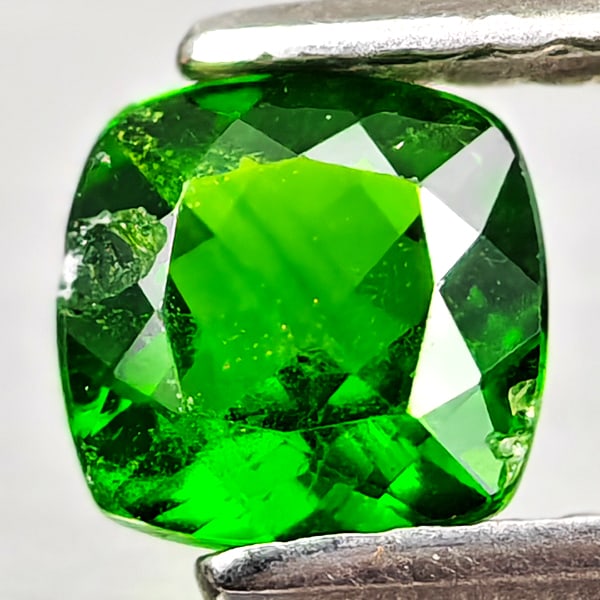 Natural Green Chrome Diopside 0.58 Ct. Cushion Shape 5.2 Mm Gemstone From Russia: Product ID: 801608198 Product Name: Natural Chrome Diopside Weight: 0.58 CT. Size: 5.2 x 5.2 x 2.8 MM. Shape: Cushion Shape Color: Green Clarity:VSI - SI1 Luster: Good Gems Origin: Russia Treatment: U