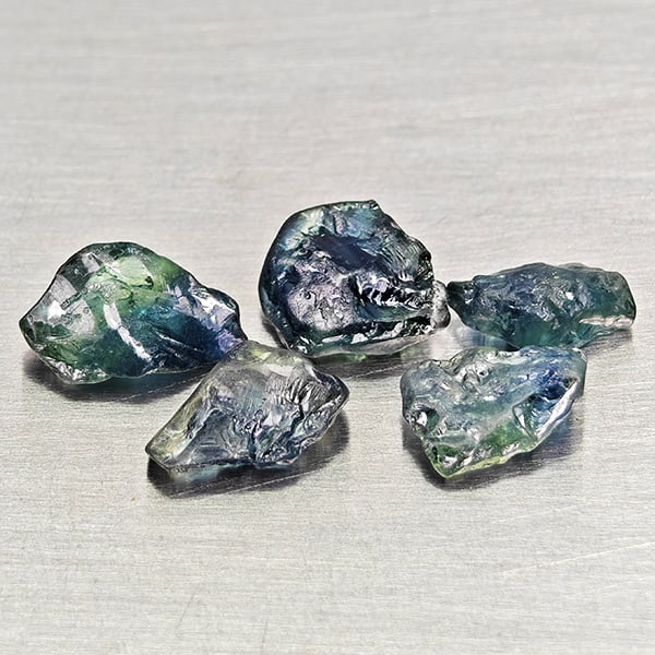 Natural Unheated Greenish Blue Sapphire 4.31 Ct. 5 Pcs Rough Shape Gemstones From Madagascar: Product ID: 806162549 Product Name: Natural Green Sapphire Weight: 4.31 CT. Size: 7.2 x 4 x2.8 to 8.4 x 5.3 x 3 MM. Shape: Rough Mixed Shape Color: Greenish Blue Clarity:VSI Luster: Good Gems Origin: