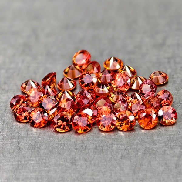 Natural Orange Red Songea Sapphire 1.27 Ct. 40 Pcs Round Diamond Cut 1.8 Mm. Gemstone From Tanzania: Product ID: 806162086 Product Name: Natural Orange Sapphire Weight: 1.27 CT. Size: 1.8 x 1.8 x 1.1 MM. Shape: Round Diamond Cut Color: Orange Red Clarity:VSI Luster: Very Good Gems Origin: Tanzania Tr