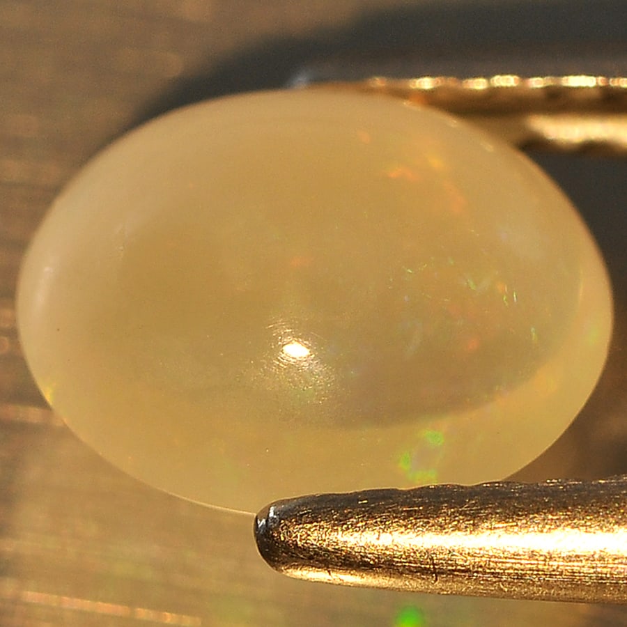 Natural Multi Color Opal 1.10 Ct. Oval Cabochon Shape 8.1 x 6.7 Mm Gemstone From Ethiopia: Product ID: 818709377 Product Name: Natural Opal Weight: 1.10 CT. Size: 8.1 x 6.7 x 4.1 MM. Shape: Oval Cabochon Color: Multi Color Clarity:Semi - Transparent Luster: Good Gems Origin: Ethiopia Treatm