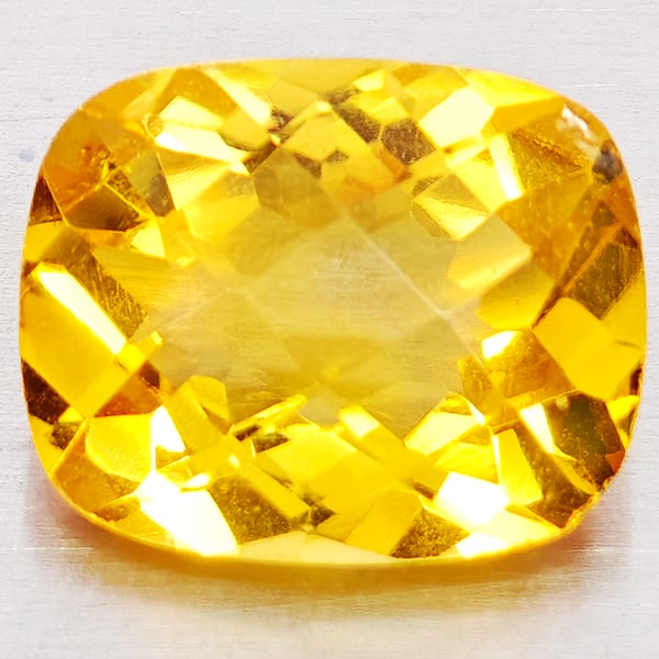 Natural Yellow Citrine 2.52 Ct. Cushion Checkerboard Cut 10.1 x 8.1 Mm. Gemstone from Brazil: Product ID: 801815196 Product Name: Natural Citrine Weight: 2.52 CT. Size: 10.1 x 8.1 x 5.3 MM. Shape: Cushion Checkerboard Cut Color: Yellow Clarity:VVS - VSI Luster: Good Gems Origin: Brazil Treatme