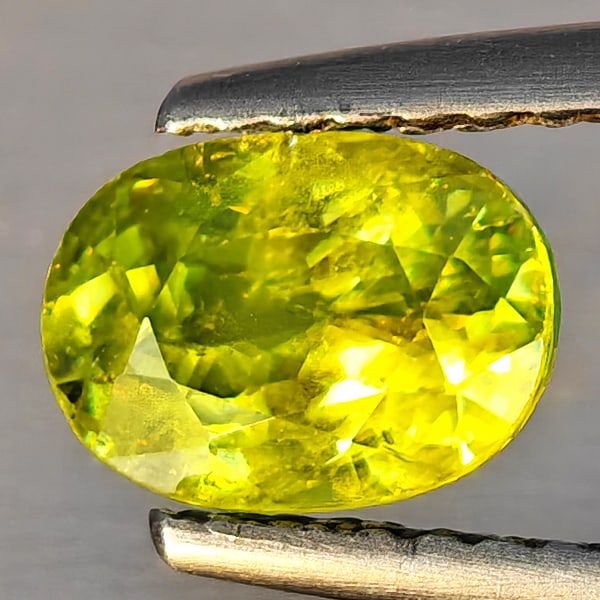 Natural Multi-Color Sphene With Rainbow Spark 1.23 Ct. Oval Shape 7.1 x 5.1 Mm. Gemstone From: Product ID: 806509234 Product Name: Natural Sphene Weight: 1.23 CT. Size: 7.1 x 5.1 x 4.4 MM. Shape: Oval Shape Color: Multi-Color Clarity:SI1 Luster: Good Gems Origin: Madagascar Treatment: Unheated 