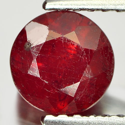 Natural Pinkish Red Ruby 1.56 Ct. Round Shape 6.2 Mm Gemstone From Madagascar: Product ID: 805933423 Product Name: Natural Ruby Weight: 1.56 CT. Size: 6.2 x 6.2 x 4.5 MM. Shape: Round Color: Pinkish Red Clarity:SI1 Luster: Good Gems Origin: Madagascar Treatment: Heated (Lead-gla