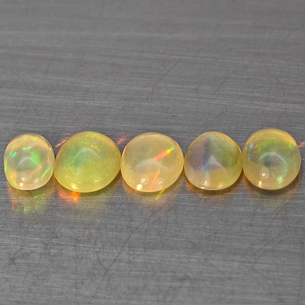 Natural Multi Color Play Of Colour Opal 1.87 Ct. 5 Pcs Oval Cabochon Shape 6 x 5 Mm Gemstones From: Product ID: 818728358 Product Name: Natural Opal Weight: 1.87 CT. Size: 6 x 5 x 2.6 MM. Shape: Oval Cabochon Color: Multi-Color Clarity:None Luster: Good Gems Origin: Ethiopia Treatment: Unheated Crys