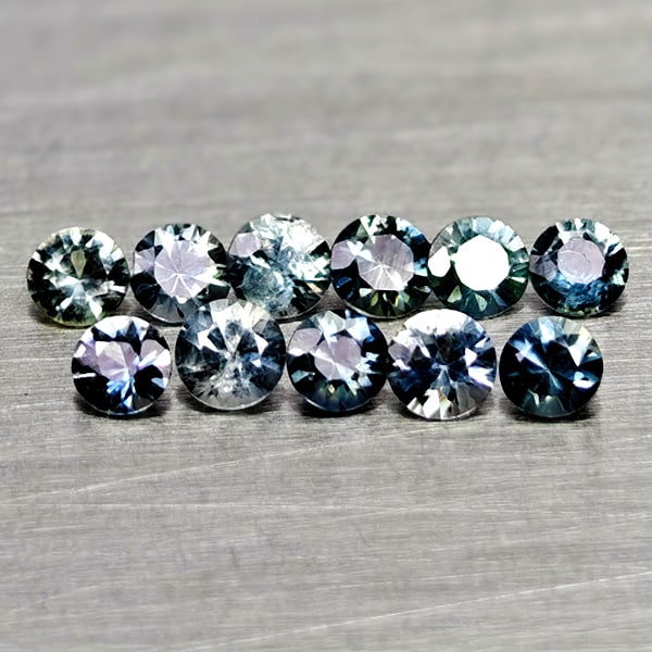 Natural Fancy Color Sapphire 0.66 Ct. 11 Pcs Round Diamand Cut 2.5 to 1.4 Mm Gemstone from Tanzania: Product ID: 806162286 Product Name: Natural Green Sapphire Weight: 0.66 CT. Size: 2.5 x 2.5 x 1.8 to 2.3 x 2.3 x 1.4 MM. Shape: Round Diamond Cut Color: Fancy Color Clarity:VSI Luster: Very Good Gems