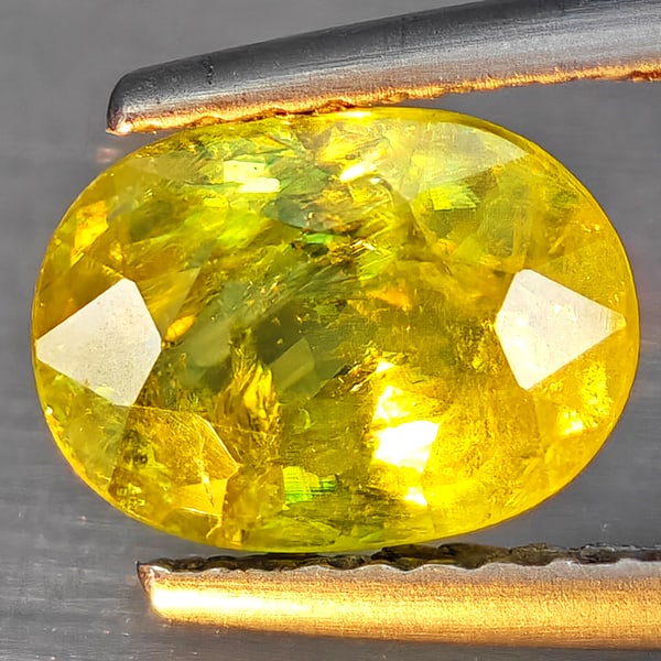 Natural Multi-Color With Rainbow Spark Sphene 1.69 Ct. Oval Shape 8.4 x 6.2 Mm Gemstone From (1 of 3)