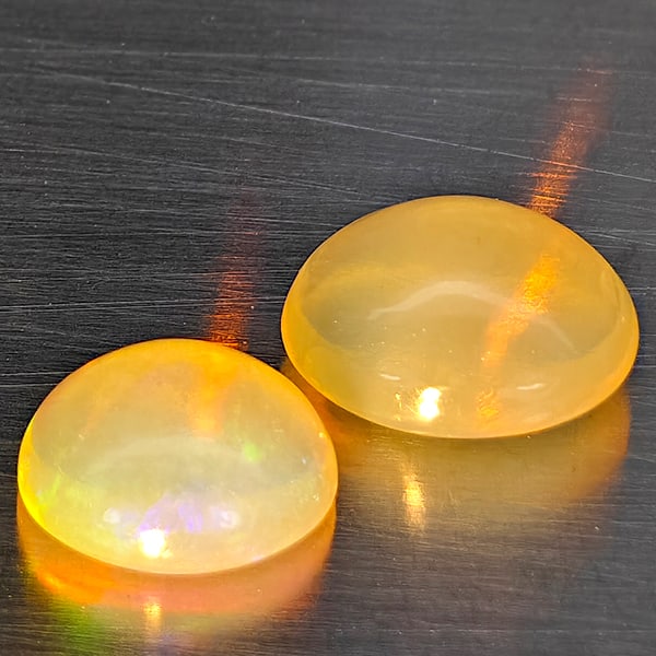 Natural Multi Color Opal 1.65 Ct. 2 Pcs Oval Cabochon Shape 8.1 x 6.8 Mm Gemstones From Ethiopia: Product ID: 818728386 Product Name: Natural Opal Weight: 1.65 CT. Size: 8.1 x 6.8 x 4.4 MM. Shape: Oval Cabochon Color: Multi-Color Clarity:Semi - Transparent Luster: Good Gems Origin: Ethiopia Treatm