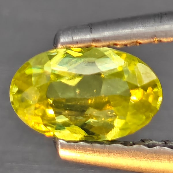 Natural Multi-Color With Rainbow Spark Sphene 0.34 Ct. Oval Shape 5.8 x 3.5 Mm Gemstone From (1 of 3)