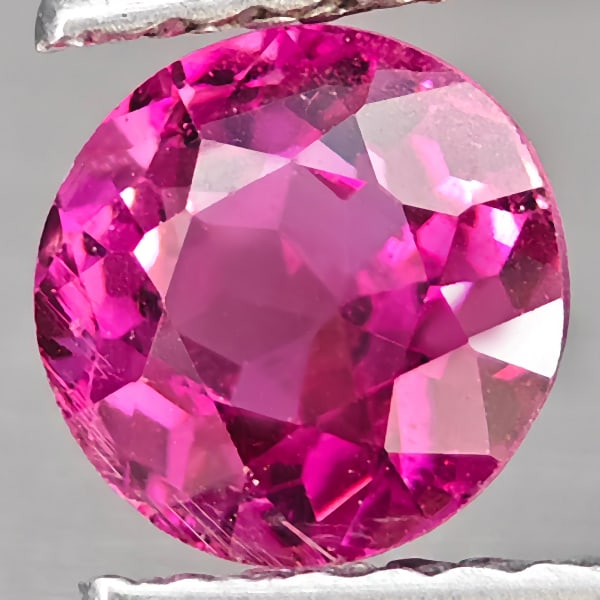 Natural Pink Tourmaline 0.91 Ct. Round Shape 5.9 Mm Gemstone from Nigeria: Product ID: 807251346 Product Name: Natural Tourmaline Weight: 0.91 CT. Size: 5.9 x 5.9 x 4.1 MM. Shape: Round Color: Pink Clarity:VSI Luster: Good Gems Origin: Nigeria Treatment: Unheated Crystal Str