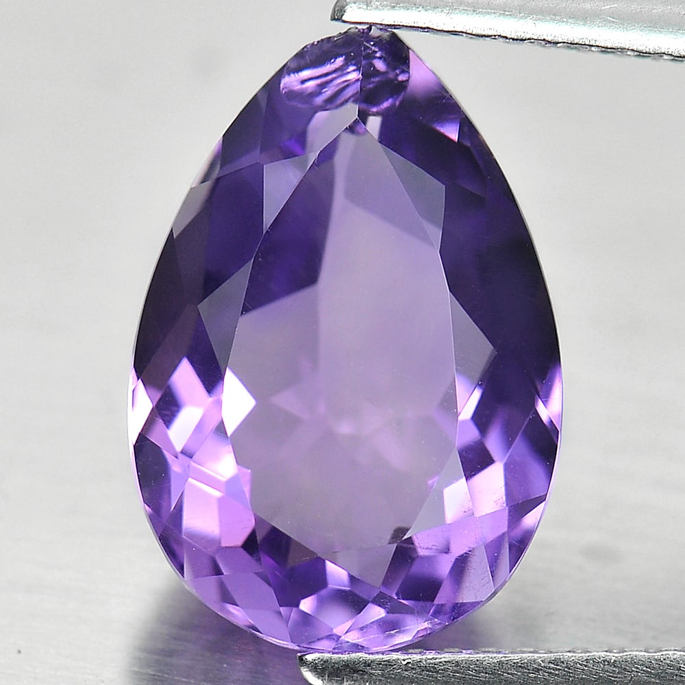 Natural Purple Amethyst 5.04 Ct. Pear Shape 14.6 x 10 Mm Gemstone From Brazil: Product ID: 800325102 Product Name: Natural Amethyst Weight: 5.04 CT. Size: 14.6 x 10 x 6.3 MM. Shape: Pear Color: Purple Clarity:SI1 Luster: Good Gems Origin: Brazil Treatment: Unheated Crystal Struc