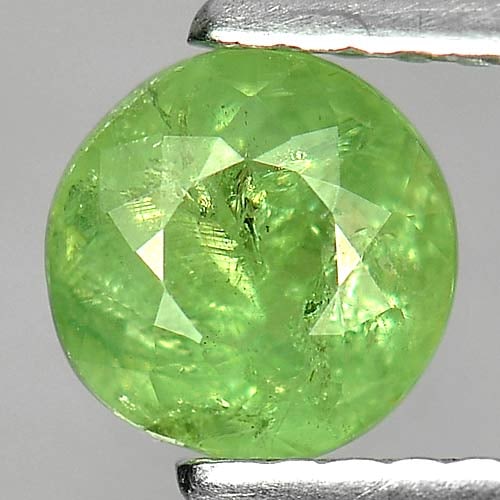 Natural Green Demantoid Garnet 1.05 Ct. Round Shape 5.9 Mm Gemstone from Madagascar: Product ID: 802919234 Product Name: Natural Demantoid Weight: 1.05 CT. Size: 5.9 x 5.9 x 3.6 MM. Shape: Round Color: Green Clarity:SI Luster: Good Gems Origin: Madagascar , Africa Treatment: Unheated