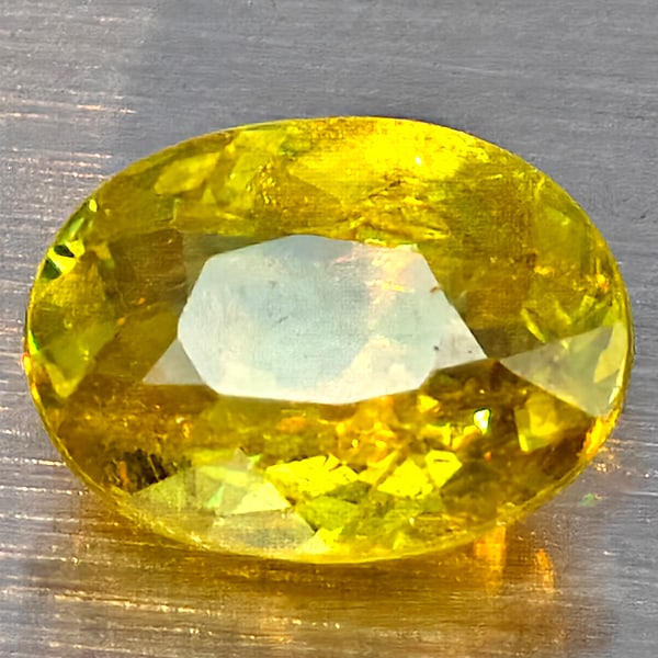 Natural Multi Color Titanium Rainbow Spark Sphene 1.66 Ct. Oval Shape 8.5 x 6.5 Mm Gemstone from (1 of 3)