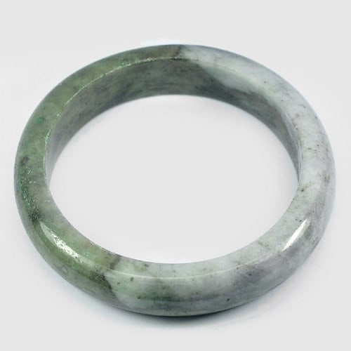 Natural Multi Color Jade Bangle 386.89 Ct. Diameter 62 Mm. Unheated Gemstone: Product ID: 819811451 Product Name: Natural Jade Weight: 386.89 CT. Size: 80 / 62 / 15 MM. Shape: Round Color: Green Clarity:Opaque Luster: Good Gems Origin: Thailand Treatment: Unheated Crystal Struc